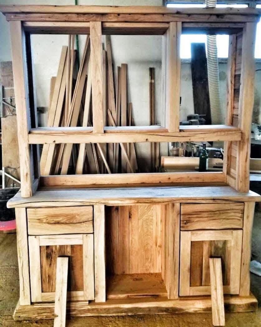 A buffet cabinet under construction in the workshop: the light wood carcass stands, doors and back panel are still missing