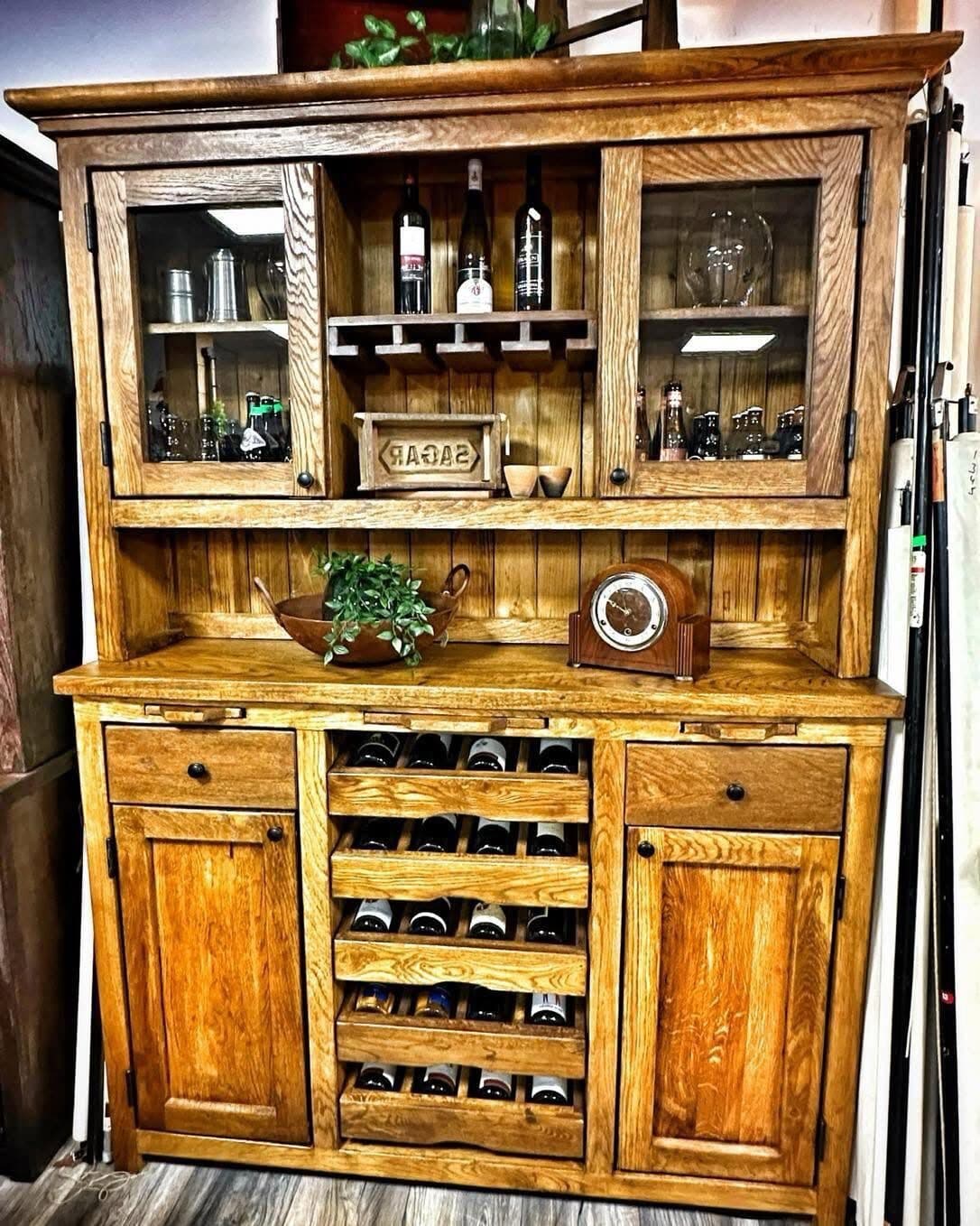 The finished buffet cabinet, oiled and filled, with a wine rack in the middle, glass doors above and drawers below